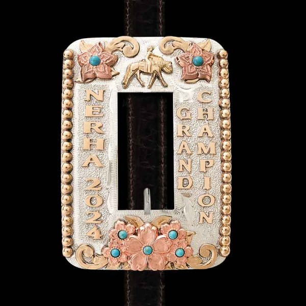 "Secure the perfect fit with style—headstall buckles that hold strong and shine bright! Our Beau Headstall Belt Buckle is expertly  hand-engraved on a German Silver base featuring  a striking tri-metal design.  Jeweler's bronze adds a bold statement 